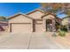 Beautiful one-story home with a two-car garage and landscaped yard at 43190 W Venture Rd, Maricopa, AZ 85138