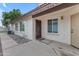 Side entry with an ornate gate and walkway leading to the back at 4337 E Corral St, Phoenix, AZ 85044