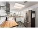 Updated kitchen with butcher block countertops and stylish backsplash at 441 S Maple St # 51, Mesa, AZ 85206