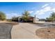 House exterior with a large driveway and mature trees at 509 E Adamanda Ct, Phoenix, AZ 85086