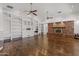 Spacious living room with built-in shelving, fireplace, and hardwood floors at 509 E Adamanda Ct, Phoenix, AZ 85086