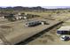 Expansive lot featuring a charming single-story home with metal roof and convenient outdoor storage at 6326 N Deer Trl, Maricopa, AZ 85139