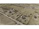 Bird's-eye view showcasing dwellings and wide graded roads in a vast desert neighborhood at 6326 N Deer Trl, Maricopa, AZ 85139