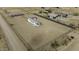 Aerial view of a white manufactured home, shed, and a large fenced-in property at 6326 N Deer Trl, Maricopa, AZ 85139