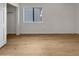 Bedroom with wood-look floors and a window at 6520 W Eagle Talon Trl, Phoenix, AZ 85083