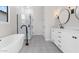 Elegant bathroom featuring a freestanding tub, double vanity, and patterned tile floor at 685 E Greenback Dr, San Tan Valley, AZ 85140