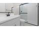 Modern bathroom with white vanity, walk-in shower, and black matte fixtures at 685 E Greenback Dr, San Tan Valley, AZ 85140