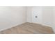 Bright bedroom with double doors and wood flooring at 685 E Greenback Dr, San Tan Valley, AZ 85140