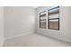 Well lit bedroom with neutral carpeting and two windows at 685 E Greenback Dr, San Tan Valley, AZ 85140