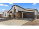 Charming house with a brick driveway and a 2-car garage at 685 E Greenback Dr, San Tan Valley, AZ 85140