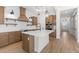 Modern kitchen with wood cabinets, white quartz countertops, and stainless steel appliances at 685 E Greenback Dr, San Tan Valley, AZ 85140