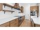 Modern kitchen with wood cabinets, white quartz countertops, and stainless steel appliances at 685 E Greenback Dr, San Tan Valley, AZ 85140