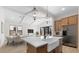 Modern kitchen with island, farmhouse sink, and open layout at 685 E Greenback Dr, San Tan Valley, AZ 85140