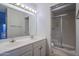 Bathroom with double sinks, vanity, and shower at 6920 E 4Th St # 105, Scottsdale, AZ 85251