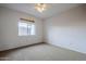 Spacious bedroom with ceiling fan and neutral carpeting at 6920 E 4Th St # 105, Scottsdale, AZ 85251