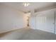 Bedroom with ceiling fan, double door closet and carpet flooring at 6920 E 4Th St # 105, Scottsdale, AZ 85251
