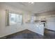 Kitchen with breakfast bar and white cabinets at 6920 E 4Th St # 105, Scottsdale, AZ 85251