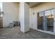 Small patio area with sliding glass door access at 6920 E 4Th St # 105, Scottsdale, AZ 85251