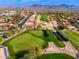 Aerial view of Pinnacle Peak Country Club Estates, showing homes, golf course, and mountains at 8641 E Clubhouse Way, Scottsdale, AZ 85255