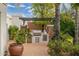 Outdoor kitchen with pergola and stainless steel appliances at 8641 E Clubhouse Way, Scottsdale, AZ 85255