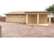 Backyard with covered patio and gravel landscaping at 9163 W Raven Dr, Arizona City, AZ 85123