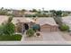 Single-story home with a two-car garage and manicured landscaping at 9353 N 113Th Way, Scottsdale, AZ 85259