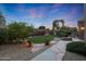 Landscaped backyard with firepit and seating area at 9353 N 113Th Way, Scottsdale, AZ 85259