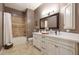Updated bathroom features double vanity, a soaking tub, and tile flooring at 9353 N 113Th Way, Scottsdale, AZ 85259