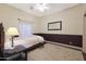 Bright bedroom with hardwood floors and ceiling fan at 9353 N 113Th Way, Scottsdale, AZ 85259