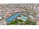 Aerial view of community pool, tennis courts, and surrounding homes at 9353 N 113Th Way, Scottsdale, AZ 85259