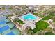 Large community pool with surrounding landscaping and tennis courts at 9353 N 113Th Way, Scottsdale, AZ 85259
