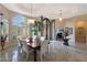 Bright dining room with a large table and chairs, and access to the entryway at 9353 N 113Th Way, Scottsdale, AZ 85259
