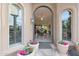 Front entry with a view into the living room. Note the beautiful door and sidelights at 9353 N 113Th Way, Scottsdale, AZ 85259