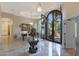 Elegant entryway with a large iron door and marble flooring at 9353 N 113Th Way, Scottsdale, AZ 85259