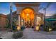 Elegant entryway with an ornate iron door and a grand light fixture at 9353 N 113Th Way, Scottsdale, AZ 85259