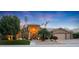 Beautiful desert home with a landscaped front yard, large garage, and inviting entryway at 9353 N 113Th Way, Scottsdale, AZ 85259