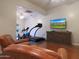 Home gym with treadmill, exercise bike and TV at 9353 N 113Th Way, Scottsdale, AZ 85259