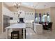 Bright kitchen with white cabinets, large island, and breakfast nook at 9353 N 113Th Way, Scottsdale, AZ 85259