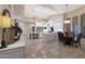 Open kitchen with white cabinets, large island, and breakfast area at 9353 N 113Th Way, Scottsdale, AZ 85259