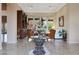 Spacious living room with large windows, comfortable seating, and built-in shelving at 9353 N 113Th Way, Scottsdale, AZ 85259