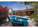 Relaxing poolside seating with beautiful sunset view at 9353 N 113Th Way, Scottsdale, AZ 85259