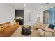 Spacious basement recreation area with comfy seating at 9540 E Spiral Ave, Mesa, AZ 85212