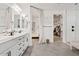 Modern bathroom with double vanity, large shower, and walk-in closet at 9540 E Spiral Ave, Mesa, AZ 85212