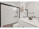 Modern bathroom with a walk-in shower and white tile at 9540 E Spiral Ave, Mesa, AZ 85212