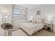 Relaxing bedroom with a comfortable bed and large windows at 9540 E Spiral Ave, Mesa, AZ 85212