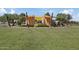 Outdoor community stage with shade structures and grassy area at 9540 E Spiral Ave, Mesa, AZ 85212