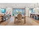 Bright dining room with wooden table and view of the pool at 9540 E Spiral Ave, Mesa, AZ 85212