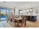 Spacious dining area with wooden table and access to backyard at 9540 E Spiral Ave, Mesa, AZ 85212
