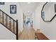 Bright entryway with modern staircase and wood-look floors at 9540 E Spiral Ave, Mesa, AZ 85212