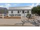 White farm store building with signage and a sidewalk at 9540 E Spiral Ave, Mesa, AZ 85212
